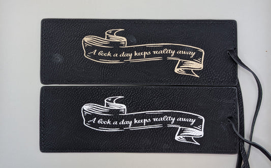 "A book a day keeps reality away" Bookmark