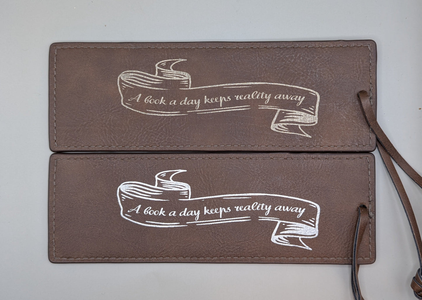 "A book a day keeps reality away" Bookmark
